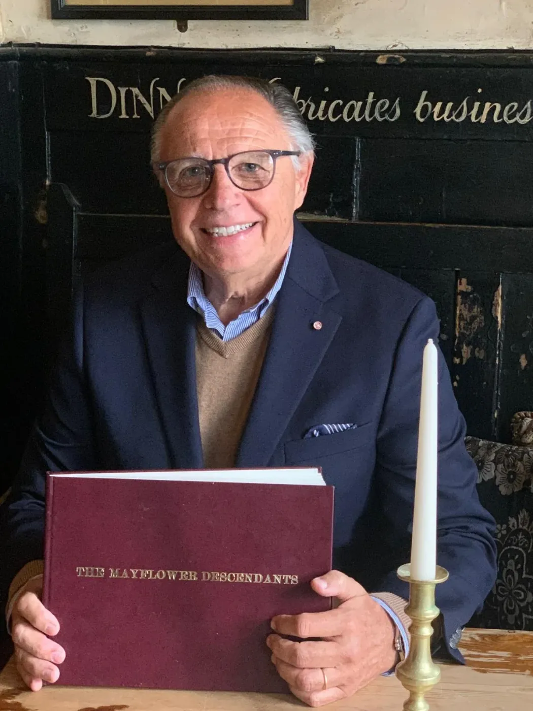 Philip Thieler, founder of Your Lineage, holding The Mayflower Descendants